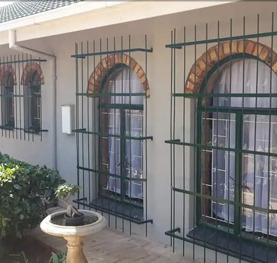 Recent job: dark green burglar bars over arched windows